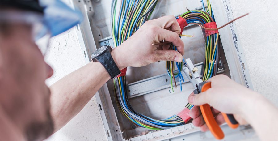 Professional technician performing minor electrical work